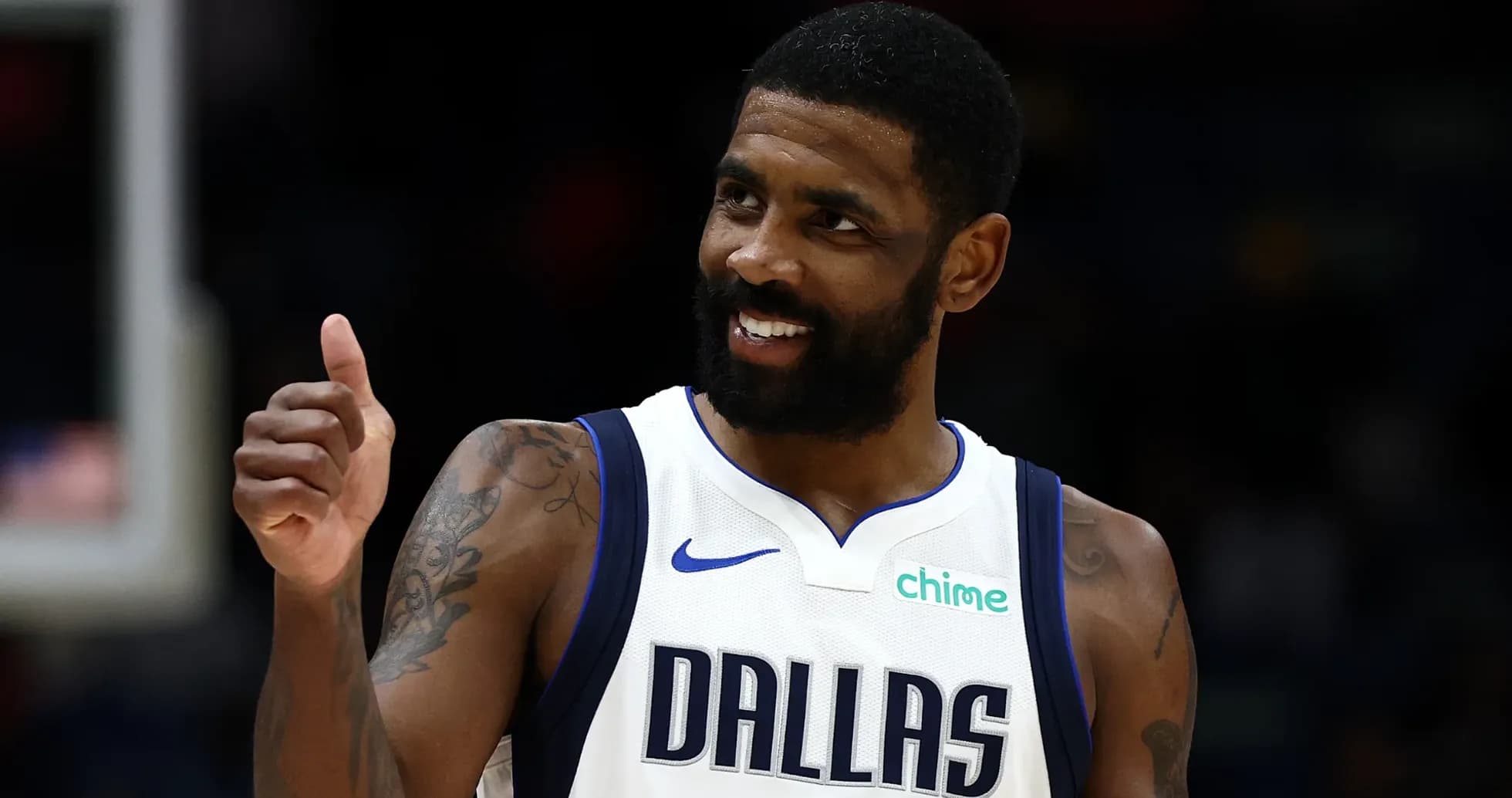 Basketball player in Dallas Mavericks jersey giving thumbs up