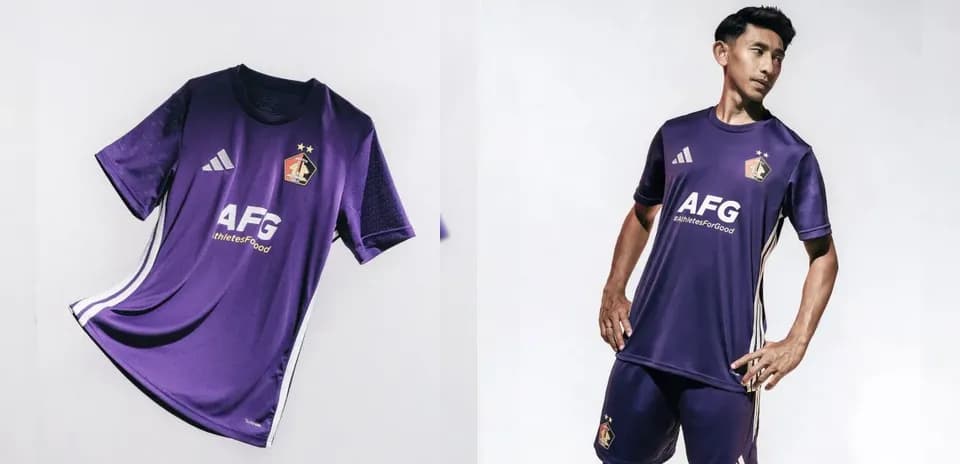 Purple football kit displayed and modeled by player
