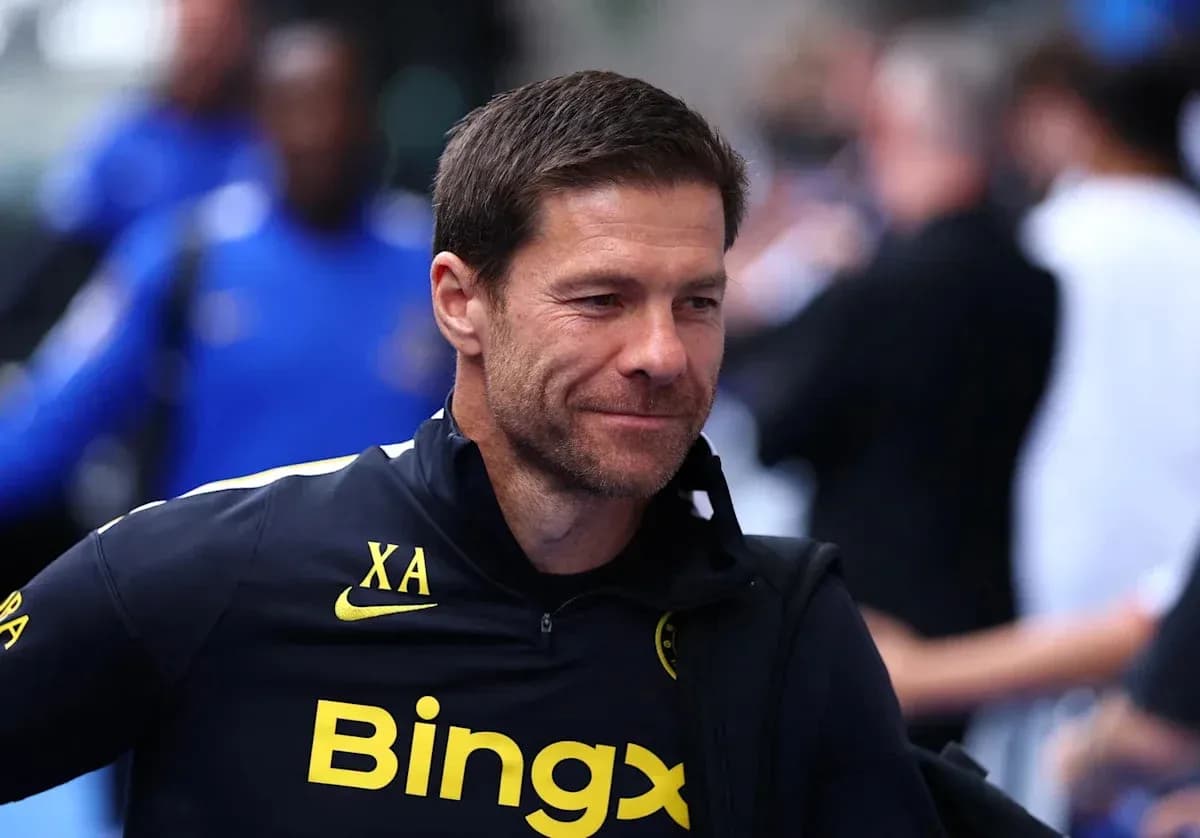 Coach walking through the stadium before match