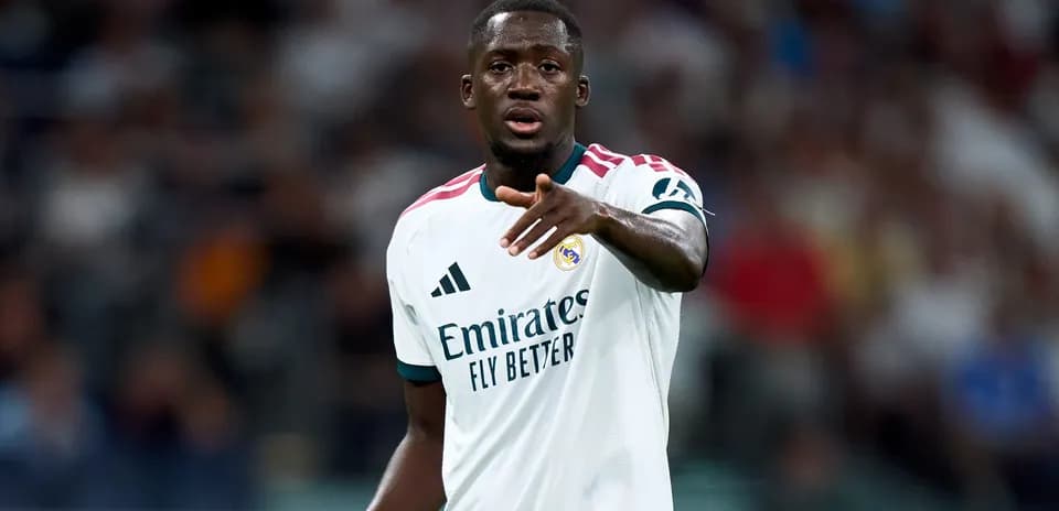 Player gesturing during match in Real Madrid jersey