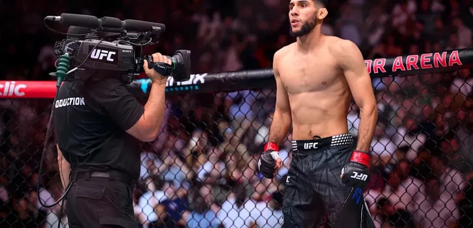 Fighter preparing for match with camera crew nearby