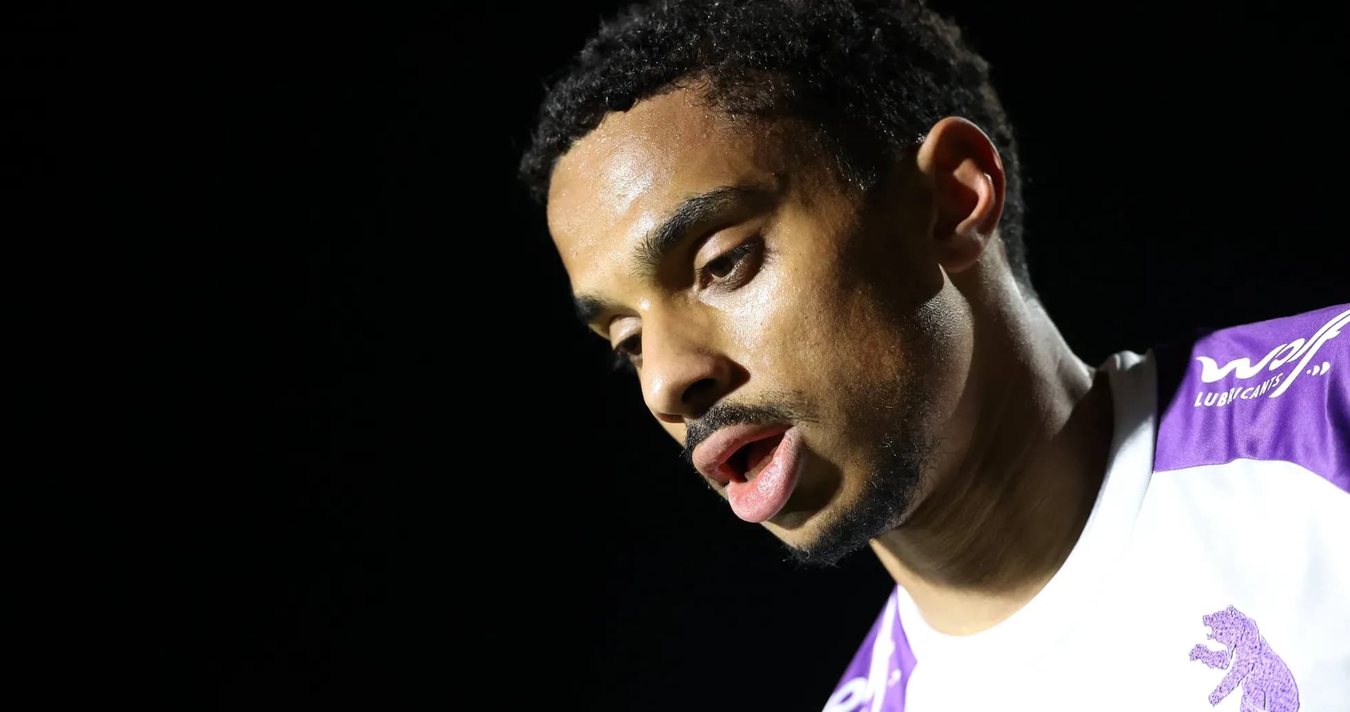 Player looking down during post-match interview