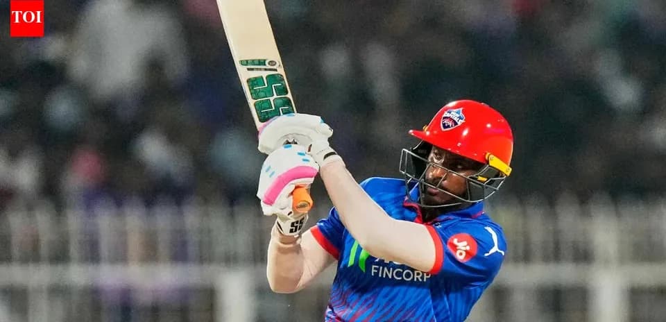 Batsman swinging bat during cricket match