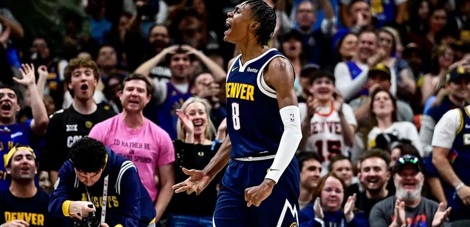 Player celebrating with fans during Denver game