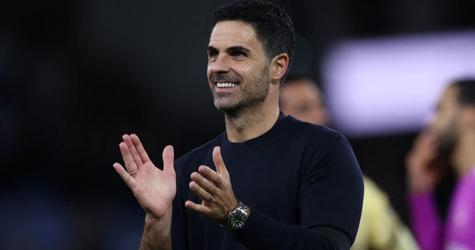 Coach clapping during a match celebration
