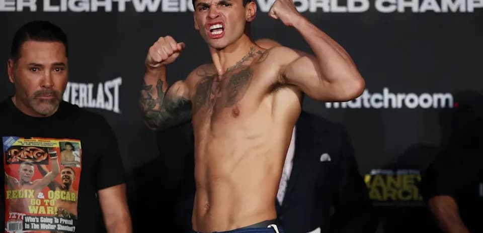 Boxer posing aggressively during weigh-in event