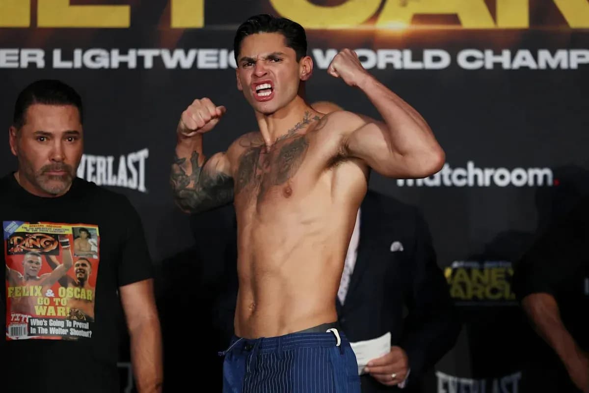 Boxer posing aggressively during weigh-in event
