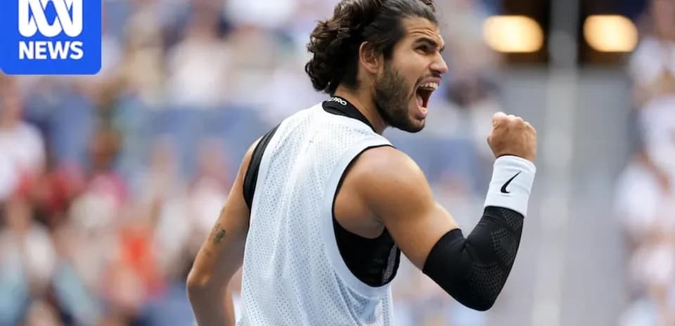 Tennis player celebrating after winning a point