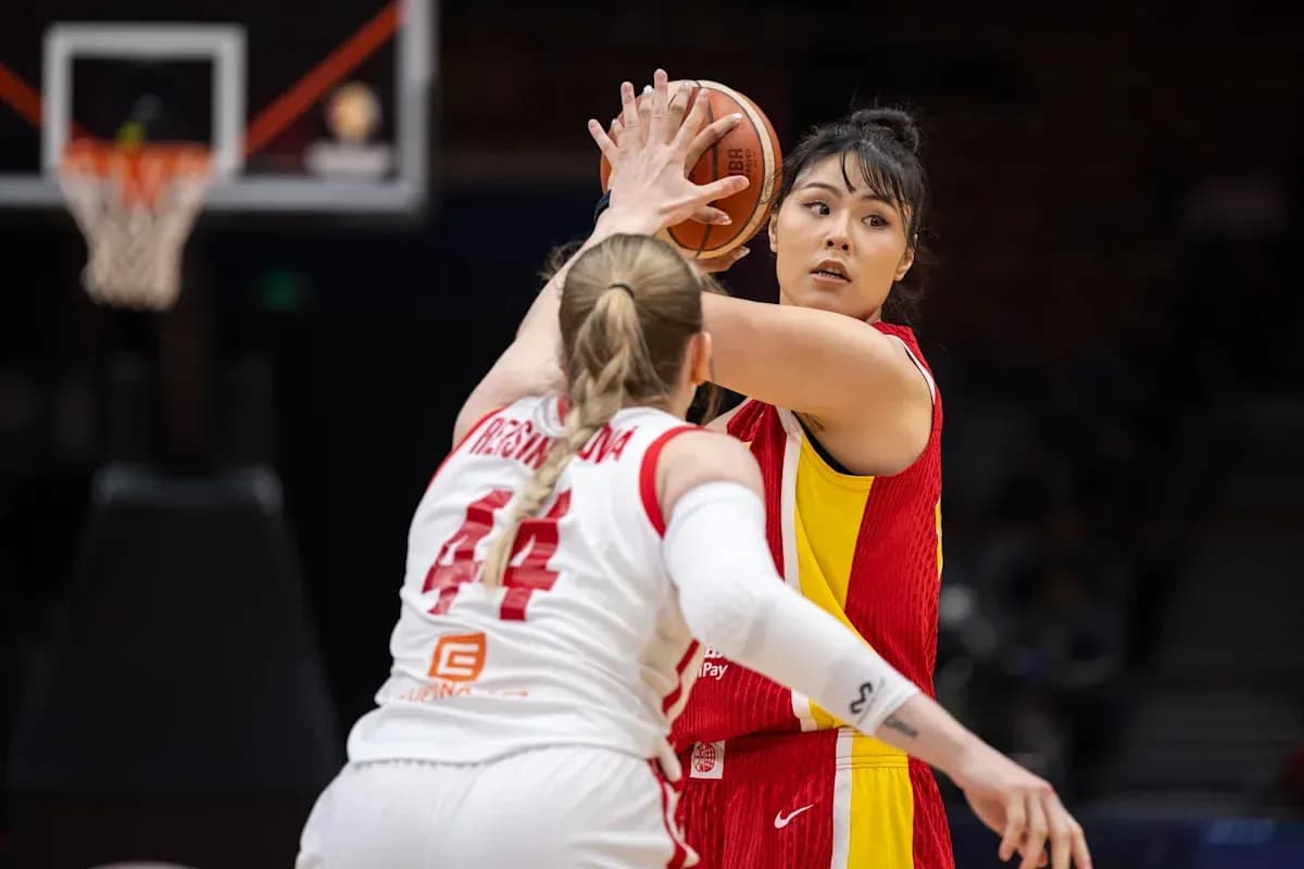 Player preparing to pass the basketball during game
