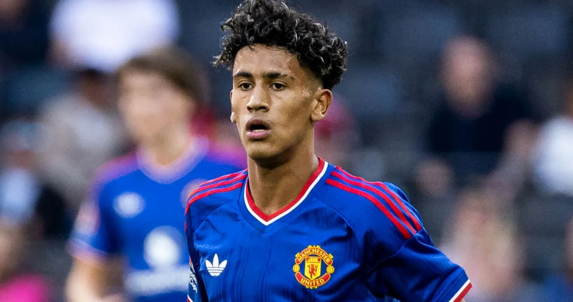 Player wearing Manchester United jersey on the field
