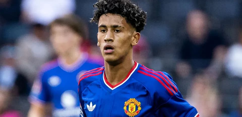 Player wearing Manchester United jersey on the field