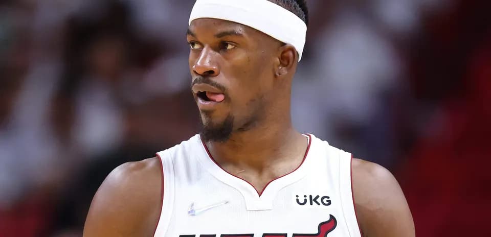Basketball player in Miami Heat uniform on court