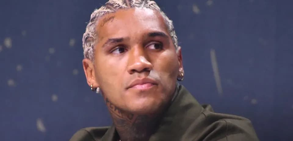 Athlete with braided hair at press conference