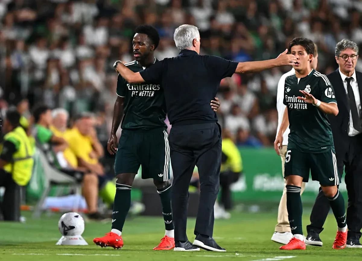 Manager instructing players during match substitution