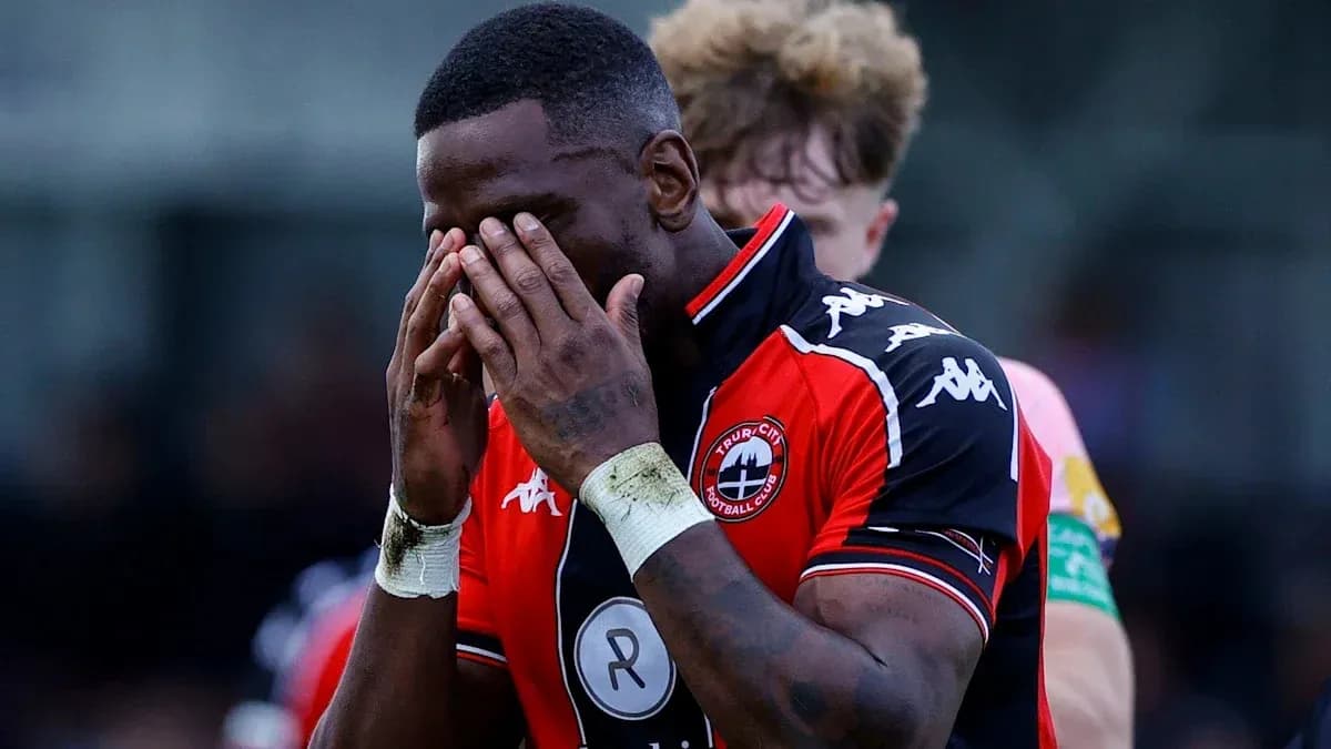 Player holding his face in disappointment on field