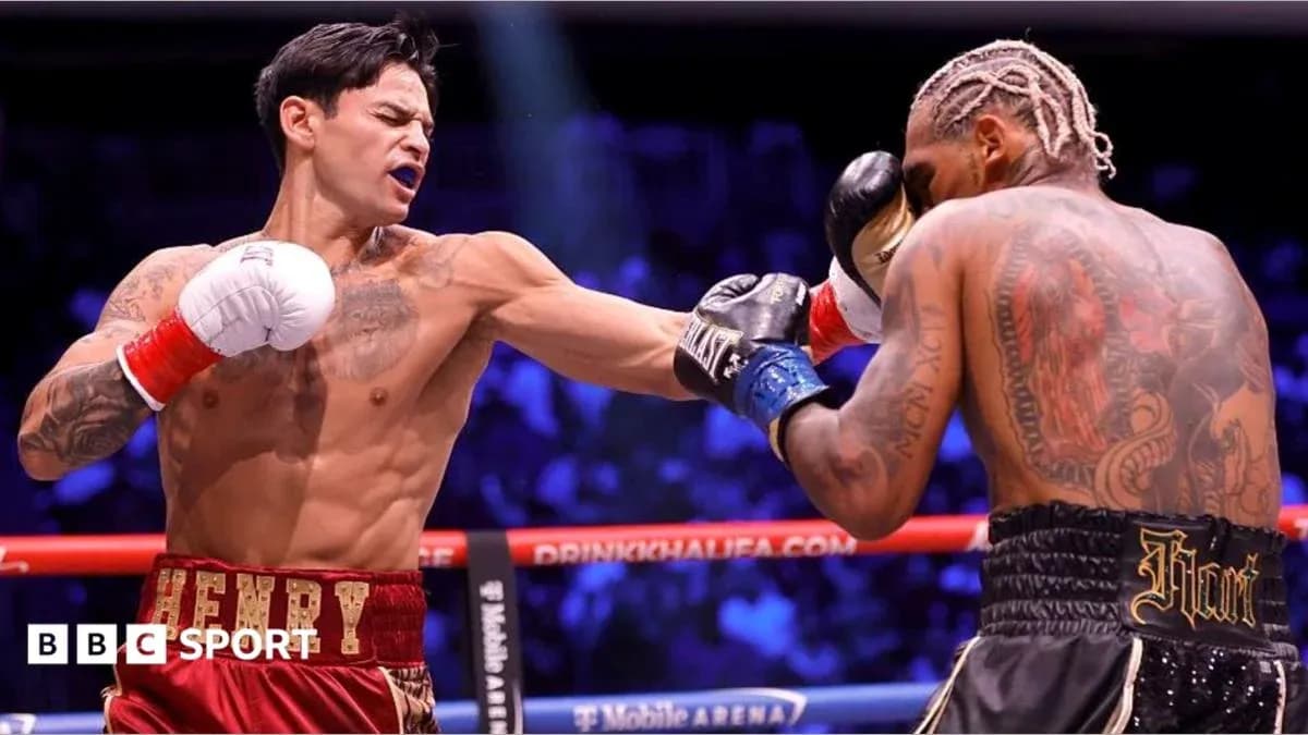 Boxer landing punch on opponent in ring