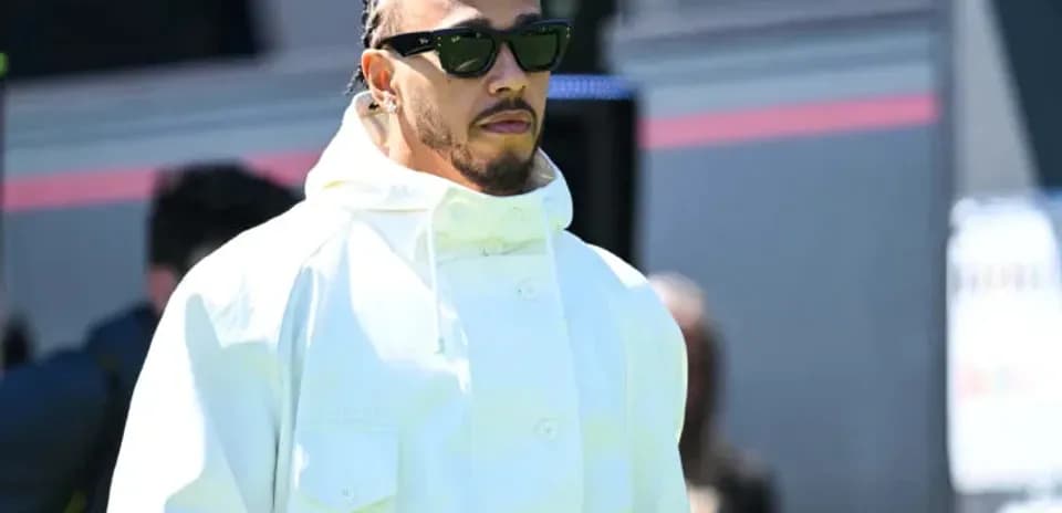 Lewis Hamilton arriving at the event wearing sunglasses
