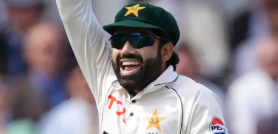 Cricketer celebrating a wicket on field