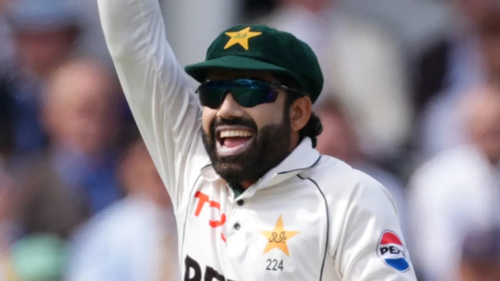 Cricketer celebrating a wicket on field