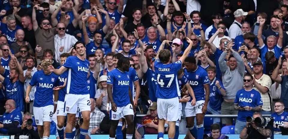 Ipswich players celebrating with fans