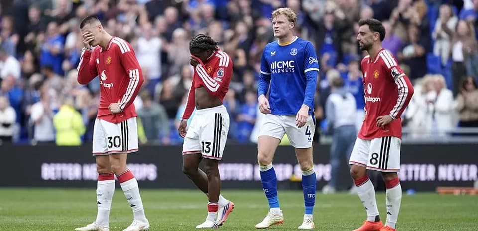Manchester United players walking off the pitch after match