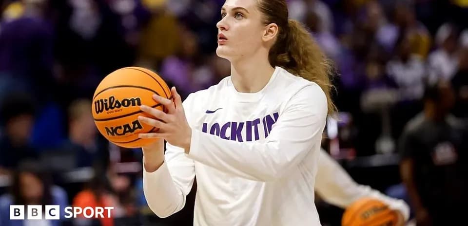 Player practicing shooting with basketball before game