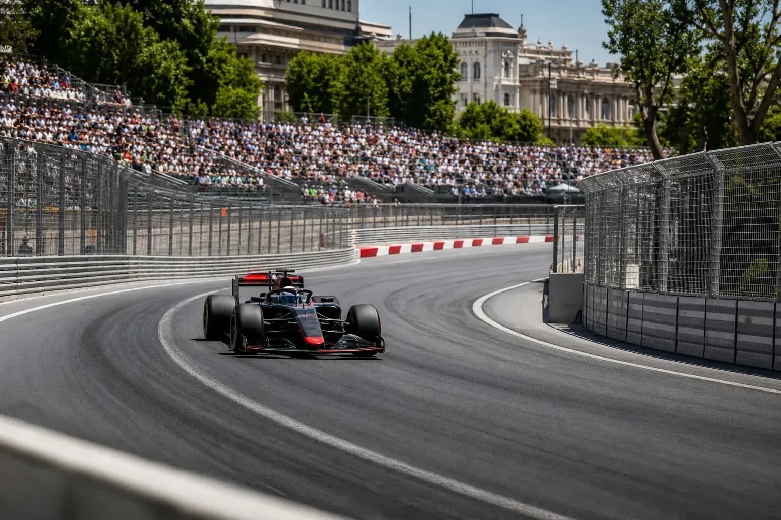 Formula 1 car racing on a winding street circuit
