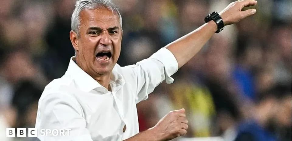Manager gesturing passionately during a match