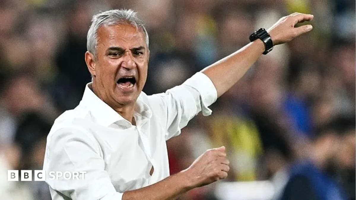 Manager gesturing passionately during a match
