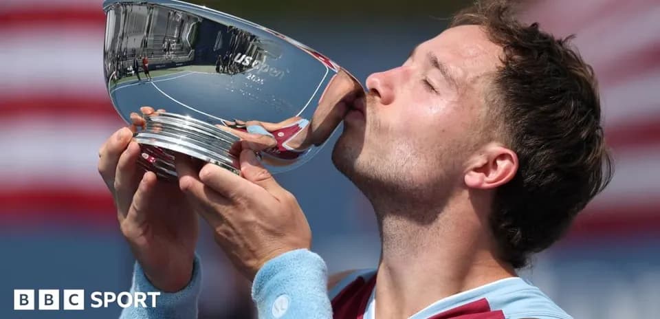 Player kissing US Open trophy after victory