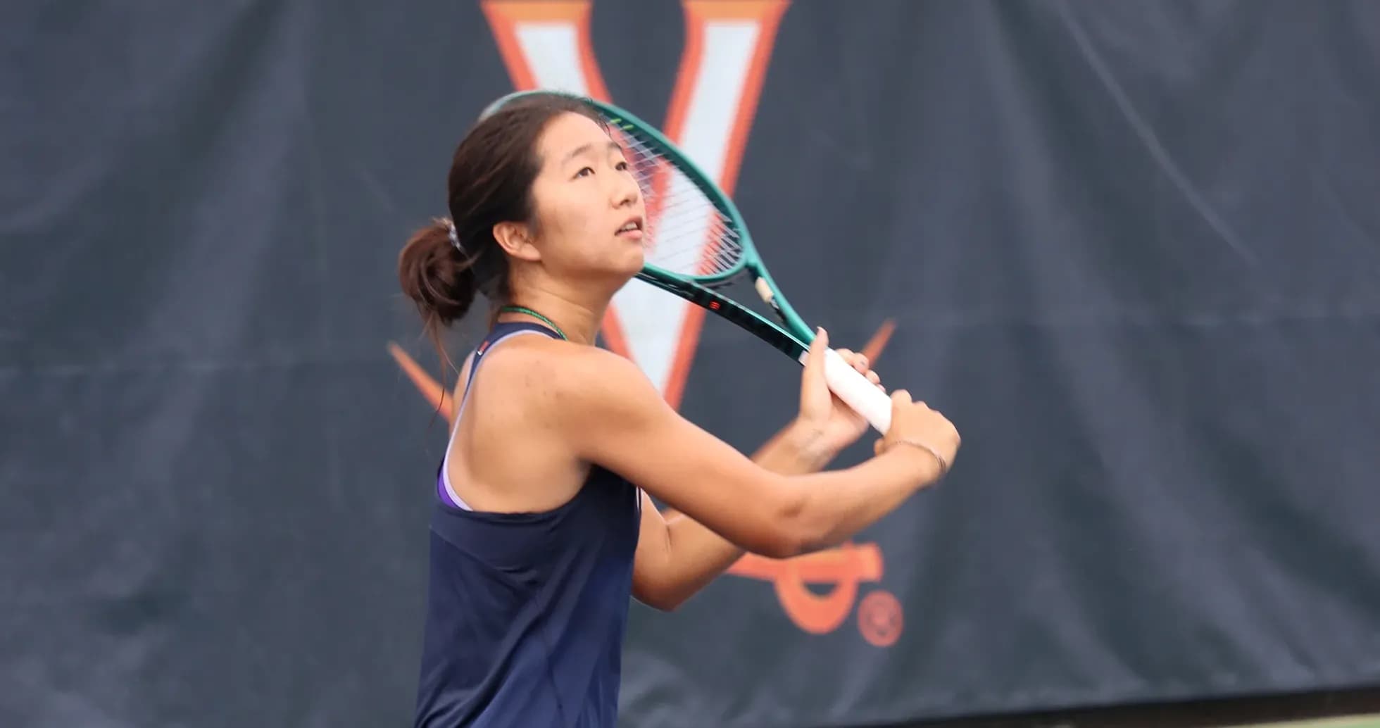 Tennis player preparing to hit a shot on court