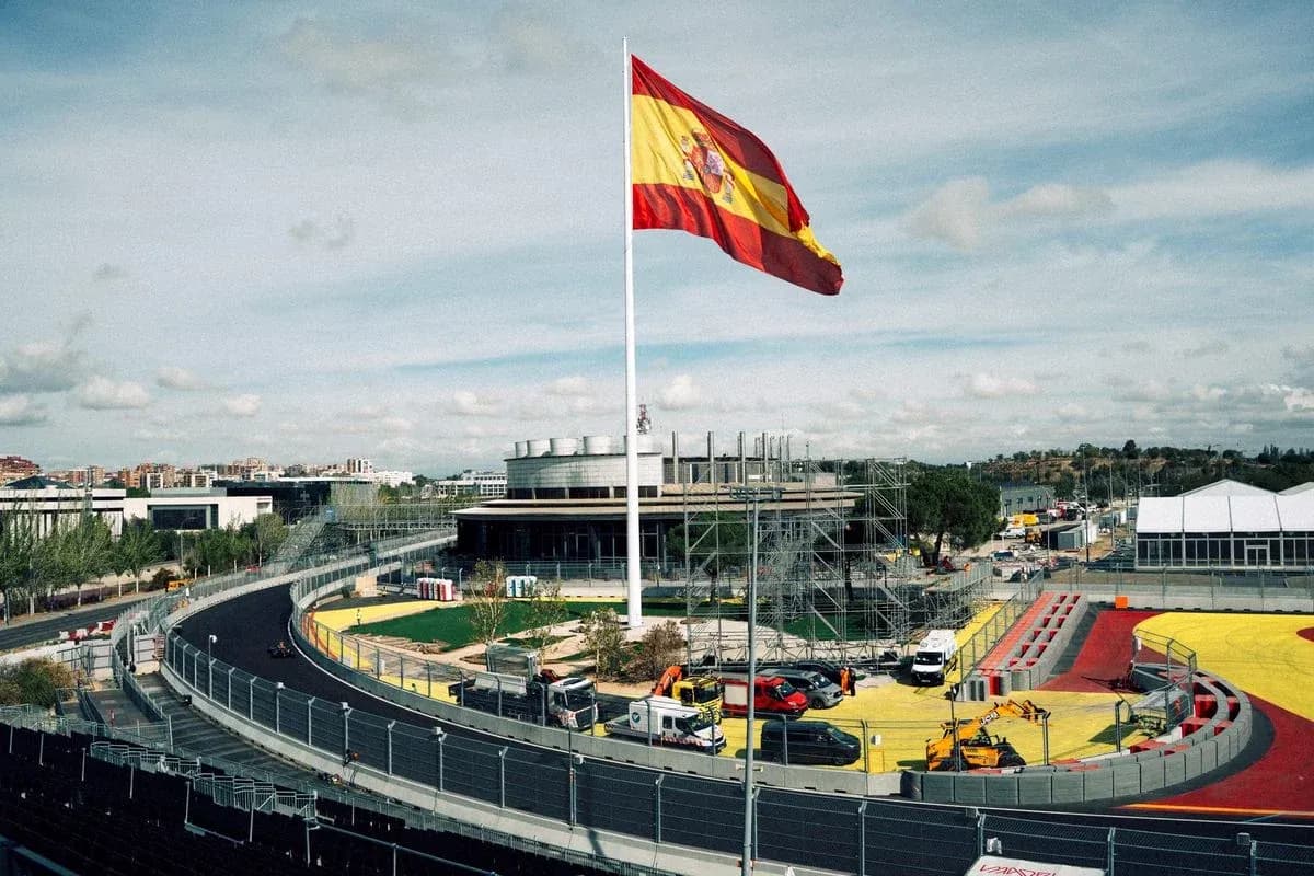 Spanish flag flying over a racing circuit under construction