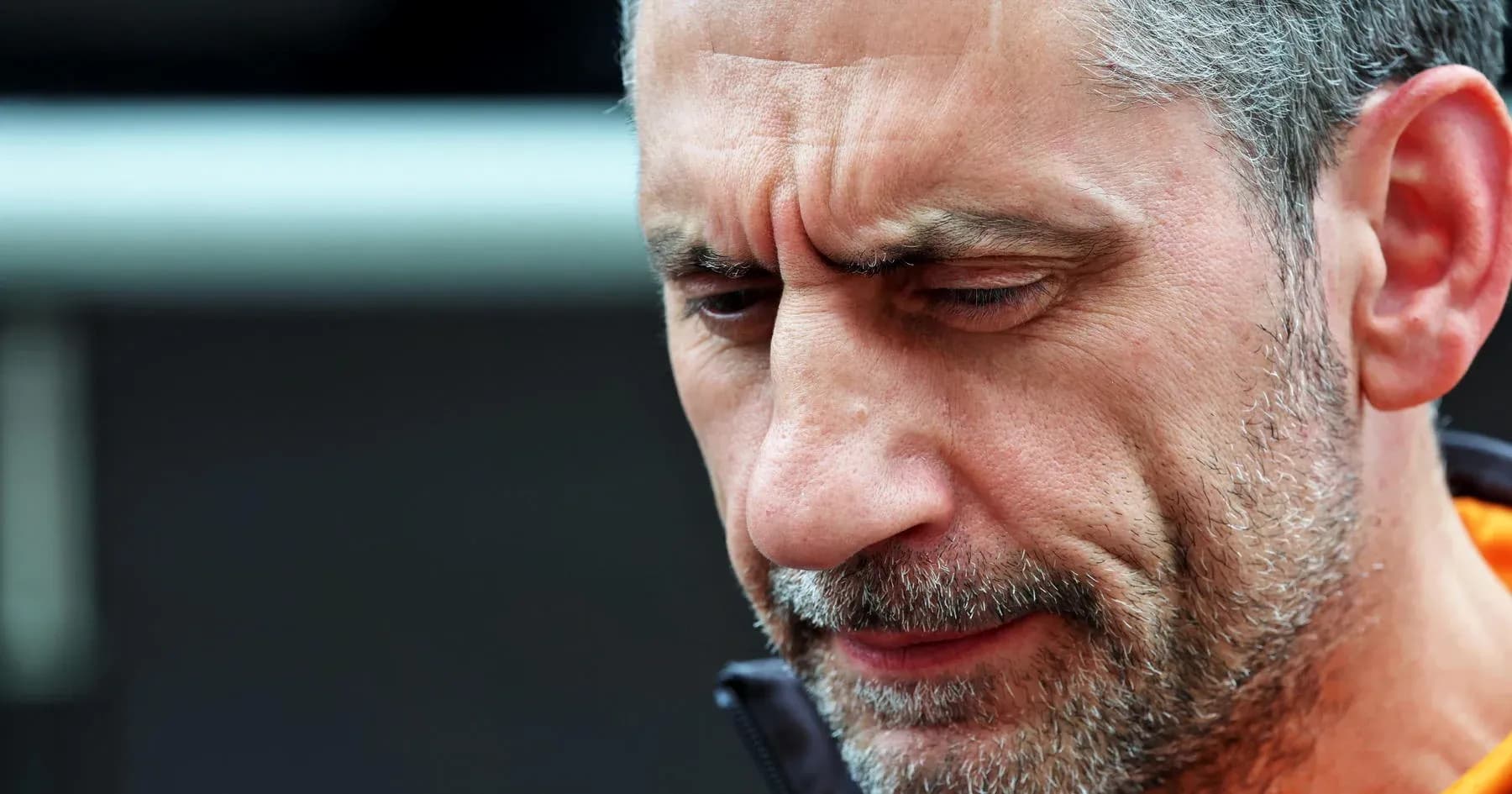 Close-up of a man with gray hair and beard