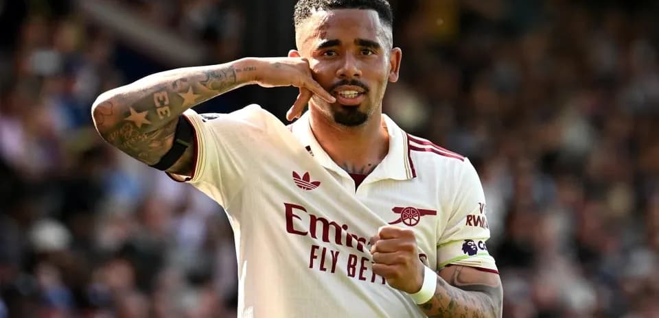Player celebrating goal with hand gesture