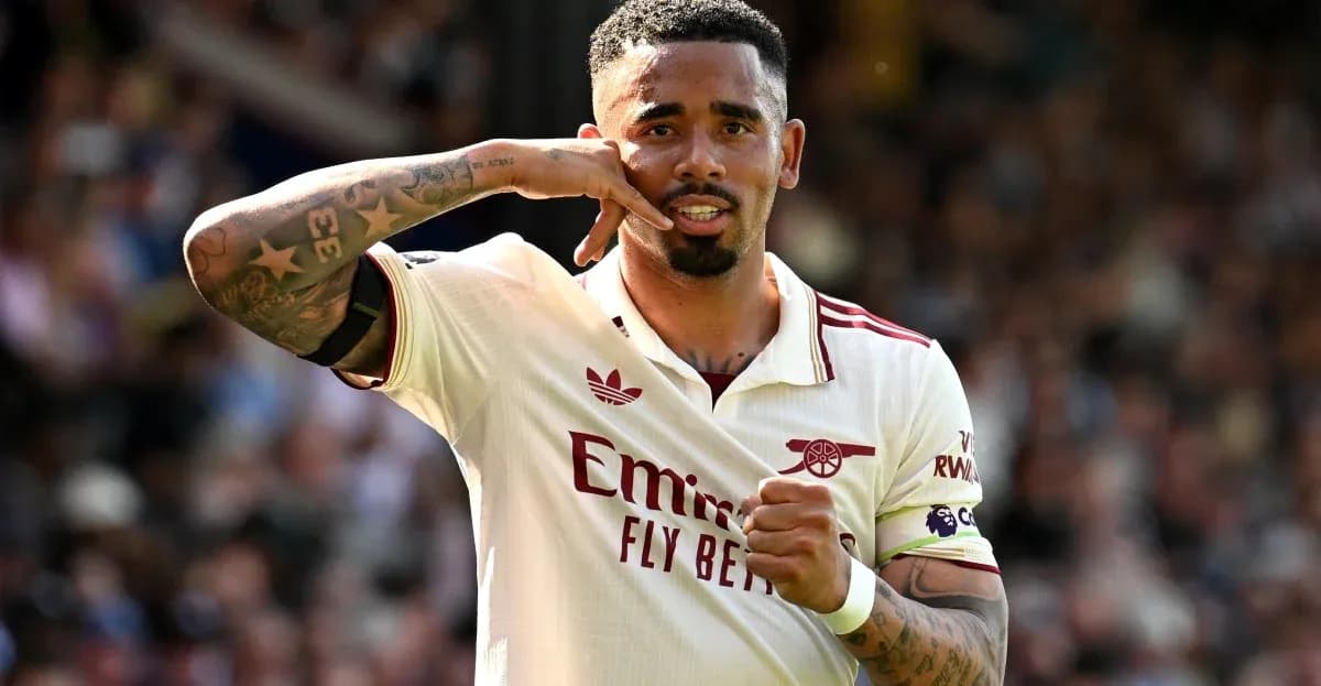 Player celebrating goal with hand gesture