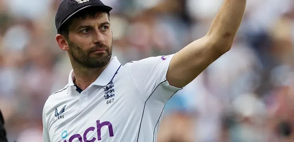 Cricketer gesturing during match in England jersey