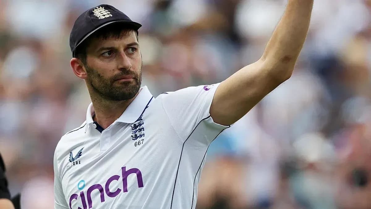 Cricketer gesturing during match in England jersey
