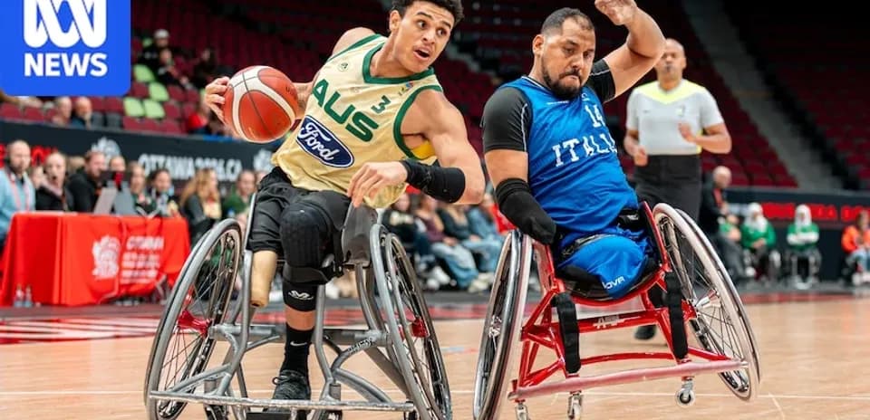 Two players competing in wheelchair basketball match