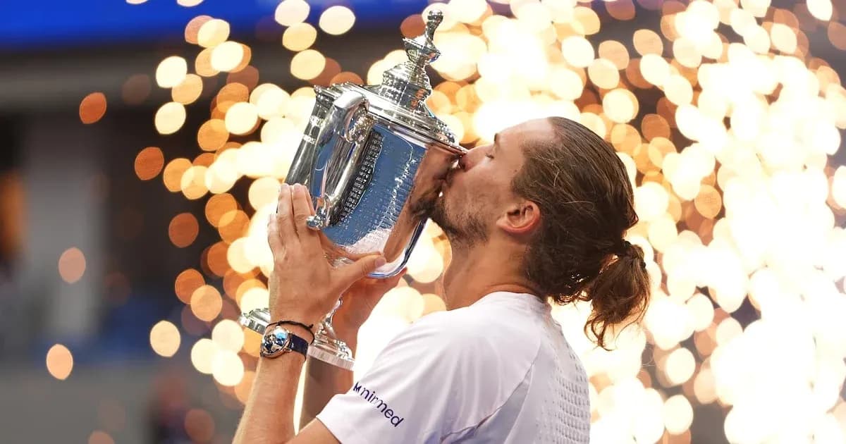 Player kissing trophy with fireworks in background