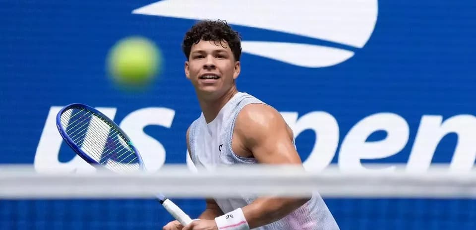 Player preparing to hit tennis ball during match