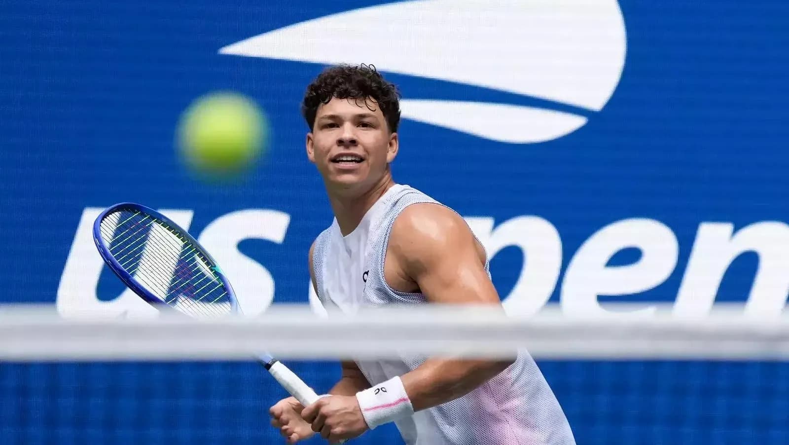 Player preparing to hit tennis ball during match