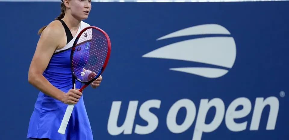 Tennis player holding racket at US Open venue