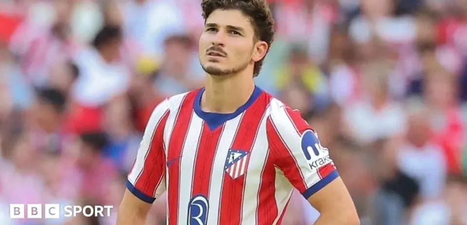 Atletico Madrid player looking concerned on the field