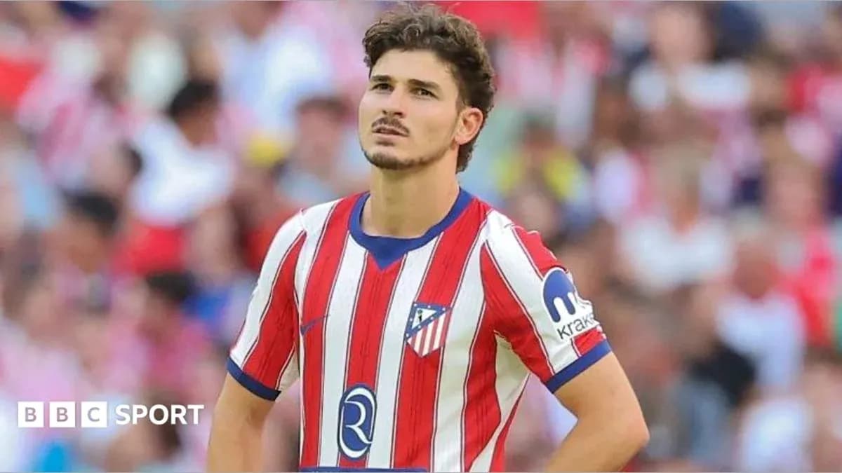 Atletico Madrid player looking concerned on the field