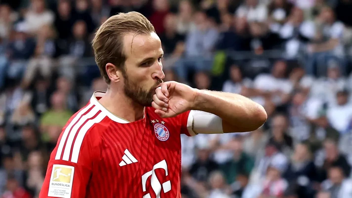 Player celebrating by kissing his arm during match