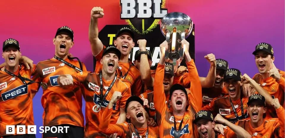 Team celebrating victory with trophy at BBL final