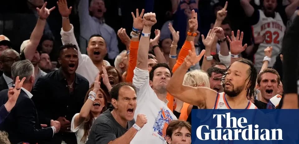 Excited crowd celebrating during basketball game