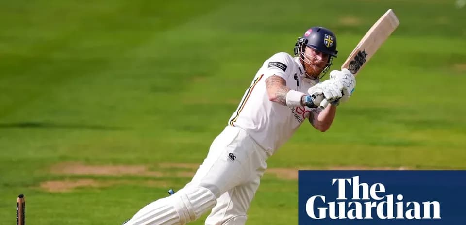 Cricketer batting during a match on the field