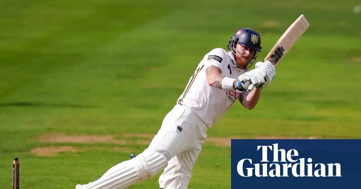 Cricketer batting during a match on the field