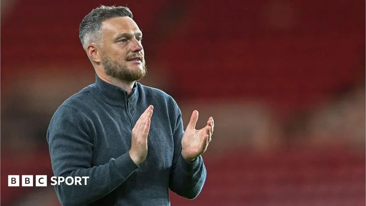Manager applauding fans after the match Manager applauding fans after the match